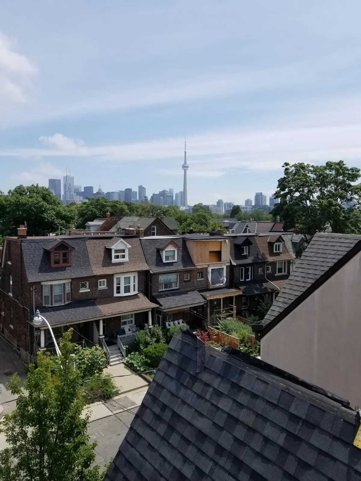 Toronto row houses with the CN Tower on the skyline